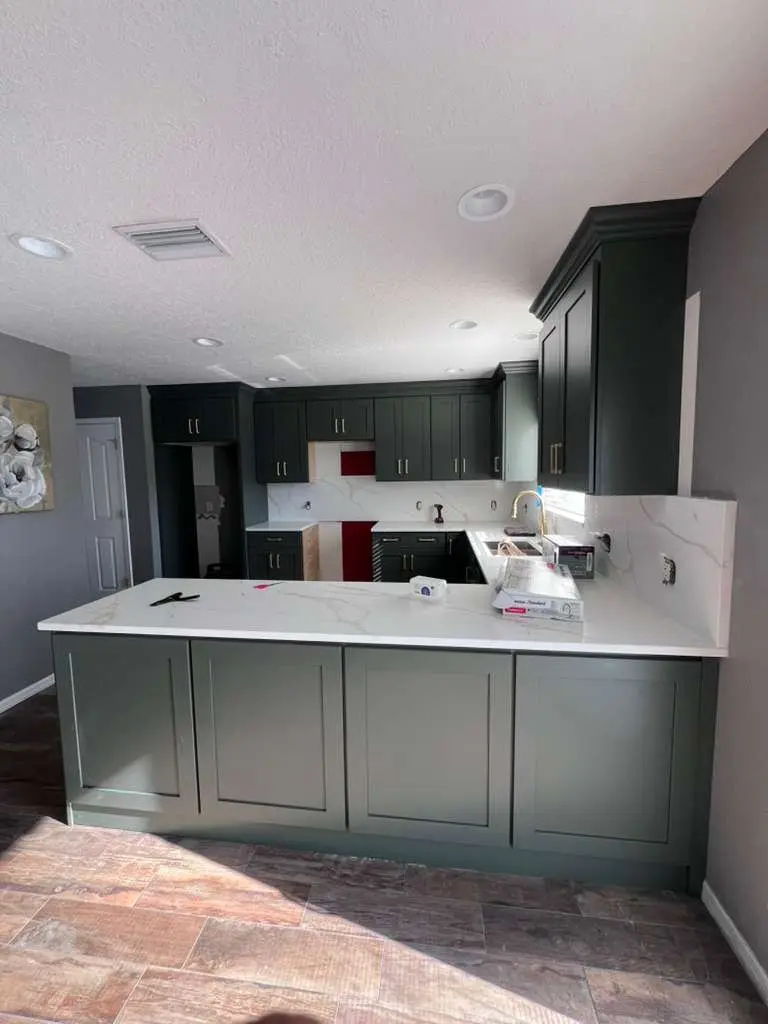 Green kitchen island cabinetry in a Tampa home