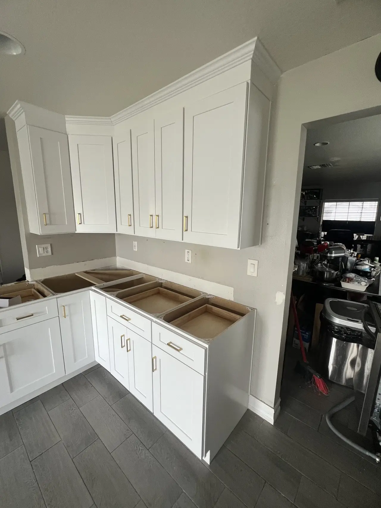 White corner kitchen cabinets with wood countertops in Tampa