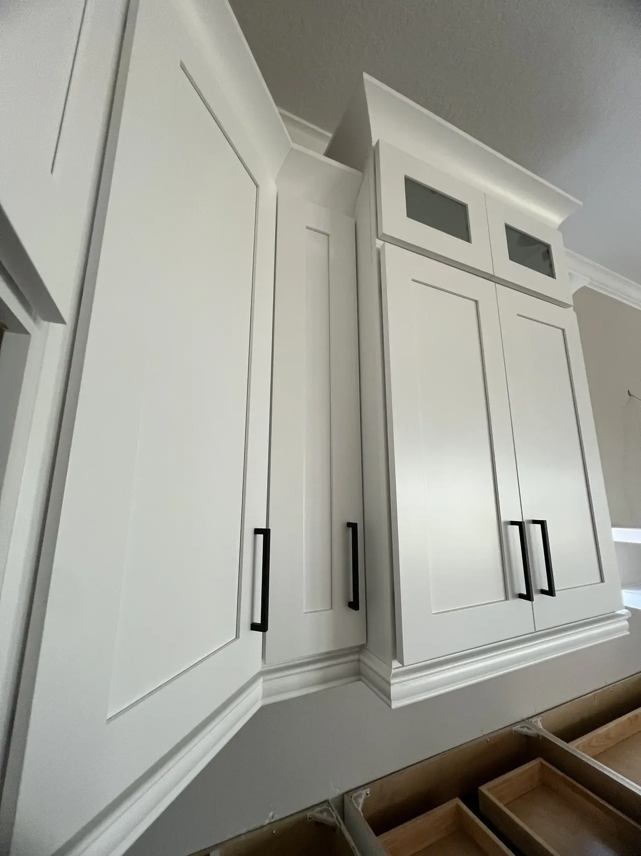 Tall pantry cabinets being installed during a Tampa kitchen installation