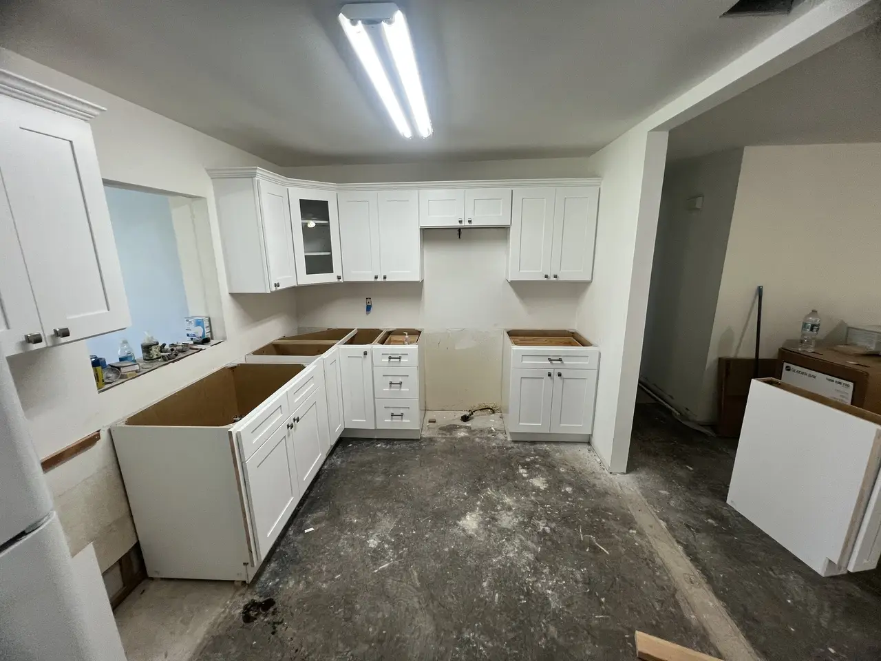 U-shaped kitchen cabinet installation in progress in a Tampa kitchen